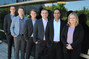 photo of Wespath employees standing by a window