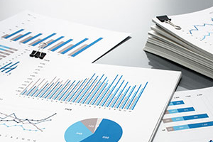 photo of papers with charts and graphs