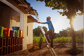 photo of man climbing a ladder